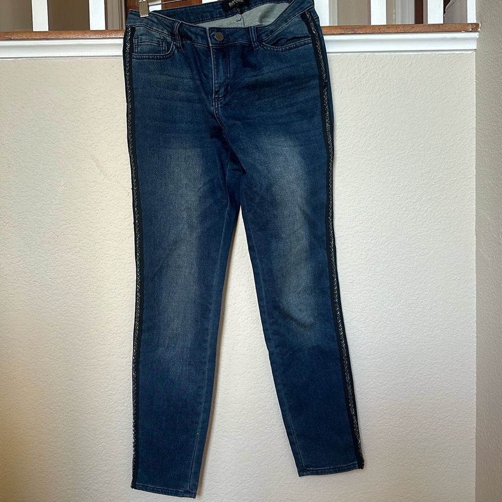 Dark wash ankle length skinny jeans